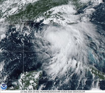 This satellite photo provided by the National Oceanic and Atmospheric Administration shows Tropical Storm Sally, Sunday, Sept. 13, 2020, at 2050 GMT.