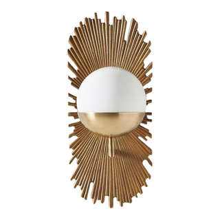 A wall sconce with gold embellishment