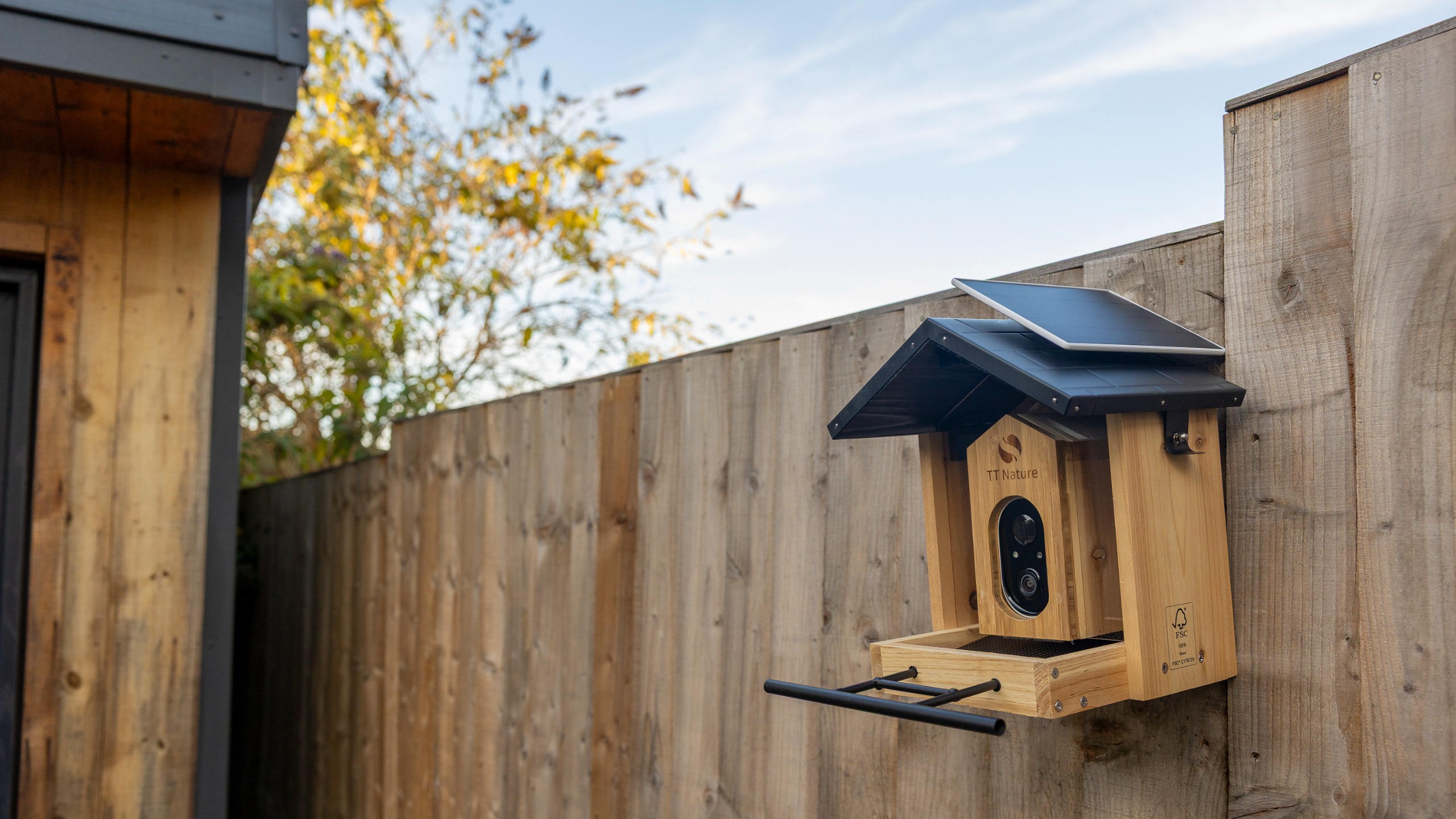 The TT Nature bird feeder camera on a garden fence