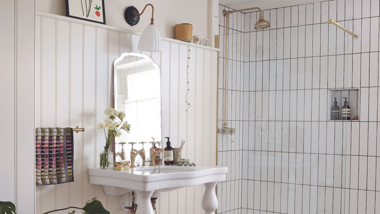 Shower with while subway tiles and vintage basin