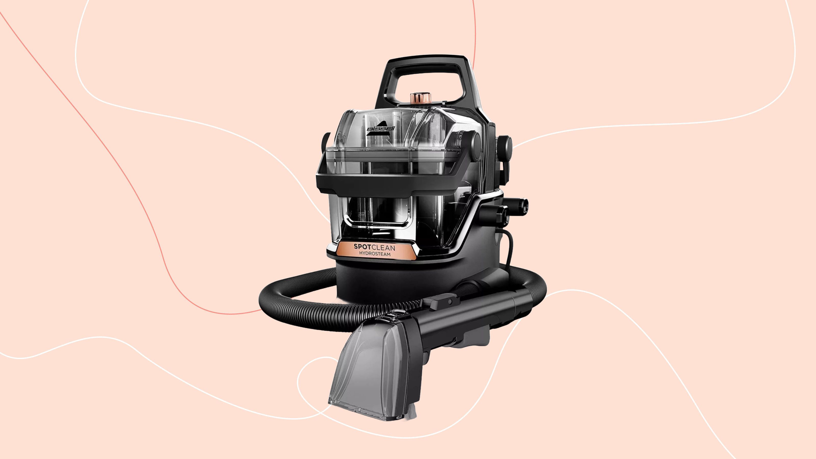 Bissell SpotClean HydroSteam on a pink background