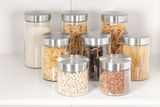 A close-up shot of a variety of seasonings and cereals stored in Clear Glass Jars a