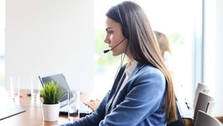 A woman working as a call centre agent 