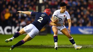 Rugby player Marcus Smith of England breaks past George Turner of Scotland during the Guinness Six Nations.