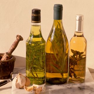 Three bottles of flavoured oils and vinegars