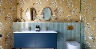 bold bathroom with gold chinoiseries wallpaper to show a key bathroom trend 2023