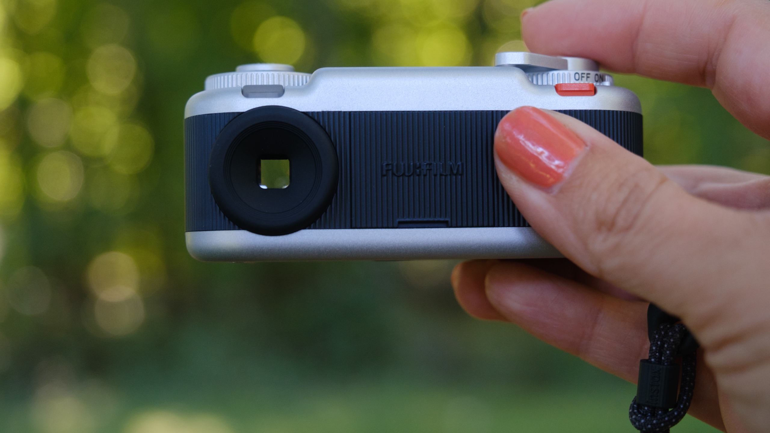 The Instax Pal 2 held in a photographer's hands
