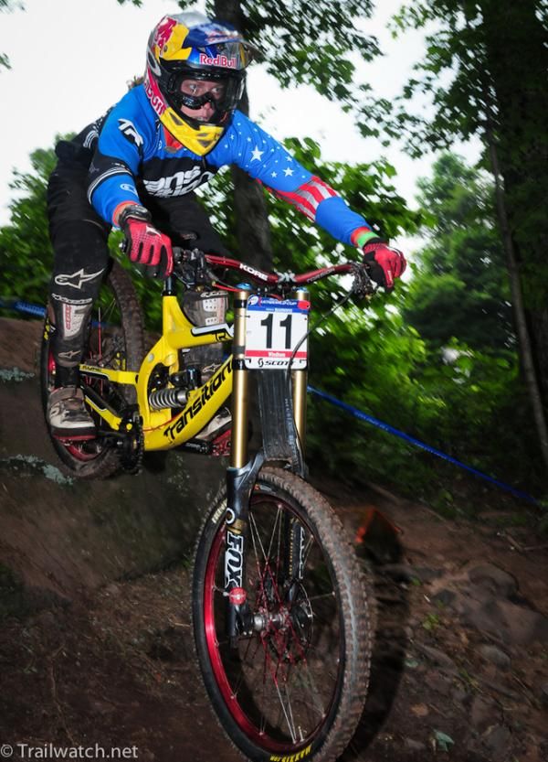 Jill Kintner (Transition-Red Bull) flying off a drop