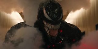 Venom gleefully grabs a smoke grenade in the lobby