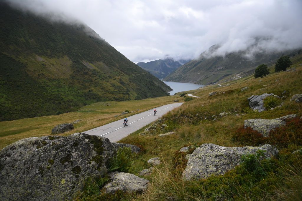 ALPE DHUEZ FRANCE AUGUST 18 Shirin Van Anrooij of The Netherlands and Team Lidl Trek and Juliette Labous of France and Team dsmfirmenich PostNL compete during the 3rd Tour de France Femmes 2024 Stage 8 a 1499km stage from Le GrandBornand to Alpe dHuez 1828m UCIWWT on August 18 2024 in Alpe dHuez France Photo by Alex BroadwayGetty Images