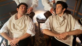 From left to right: Jonathan Bailey as Anthony Bridgerton and Luke Thompson as Benedict Bridgerton both getting a shave as two people wipe their faces.