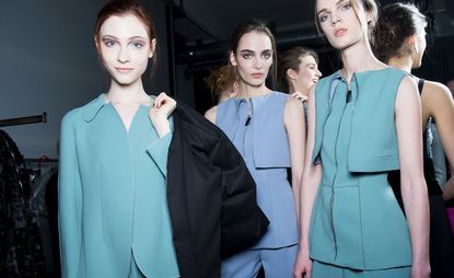 Female models wearing blue, green and grey clothes from the Giorgio Armani A/W 2015 collection
