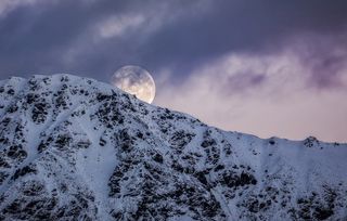 The Super Moon Sets in Queenstown by Trey Ratcliff