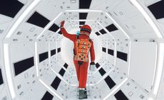 2001 the odyssey still image of an astronaut waking through an air lock. 