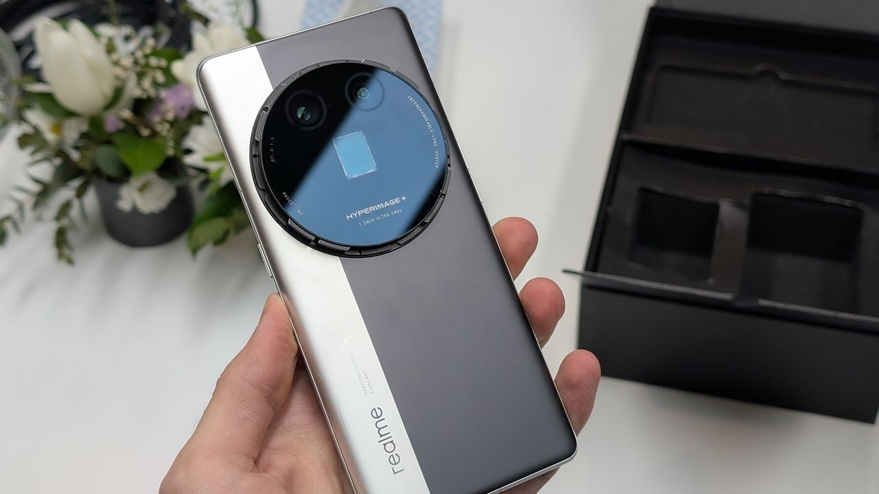 RealMe Interchangeable Lens Concept phone held in a hand