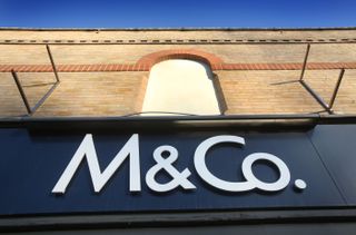 AN M&Co sign above a store