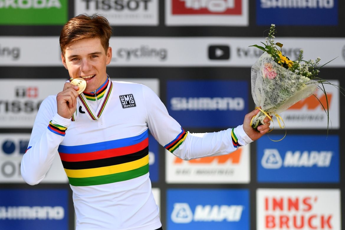 Remco Evenepoel celebrates on the podium