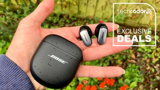 Bose QuietComfort Ultra Earbuds and their case held in a woman's hand.