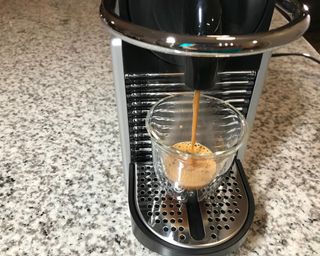 Making espresso using the Nespresso Pixie coffee maker