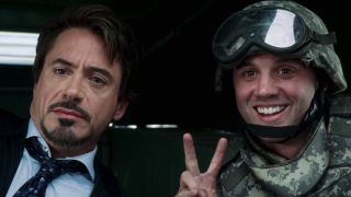 Tony Stark taking picture with soldier in Iron Man