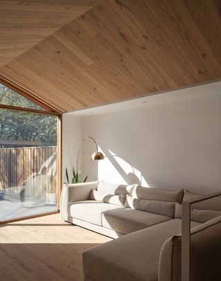 a contemporary living space with a pitched roof