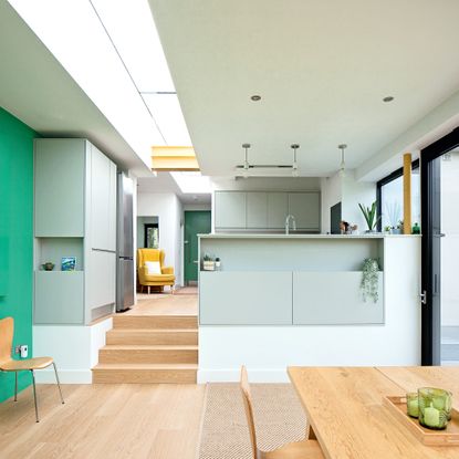 view through an open plan space showing the kitchen