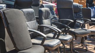 A group of used office chairs