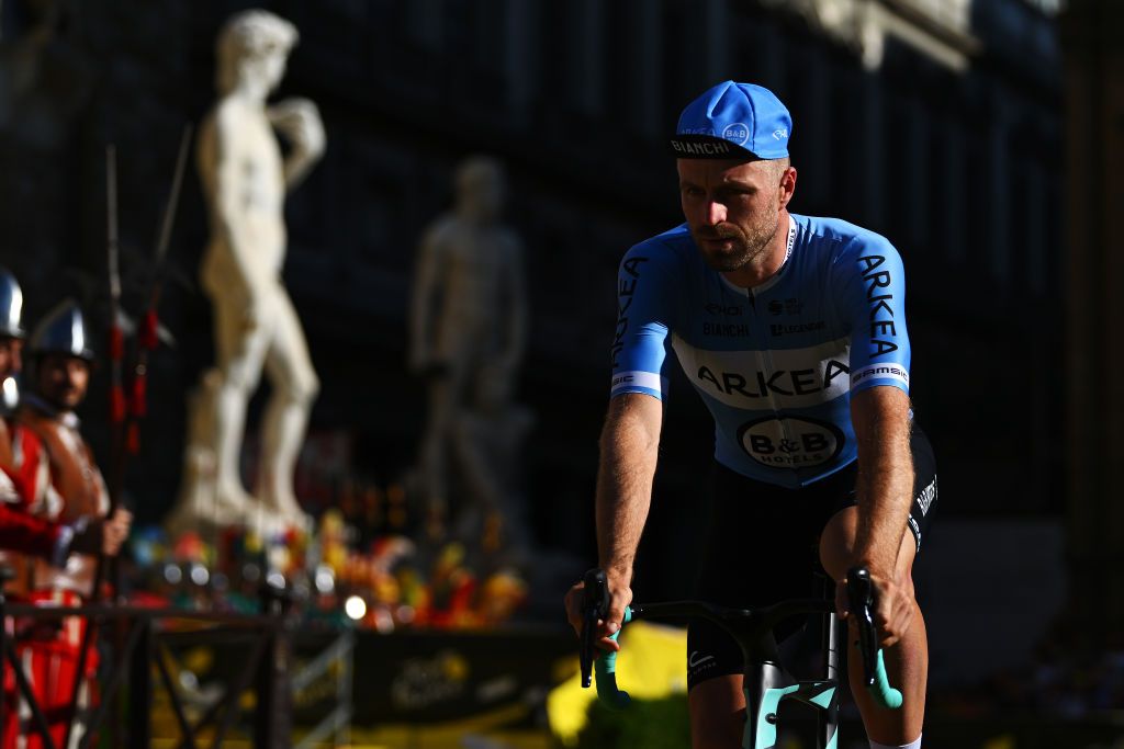 FIRENZE ITALY JUNE 27 Daniel McLay of Great Britain and Team Arkea BB Hotels with the Michelangelos David statue in the background during the 111th Tour de France 2024 Team Presentation UCIWT on June 27 2024 in Firenze Italy Photo by Dario BelingheriGetty Images