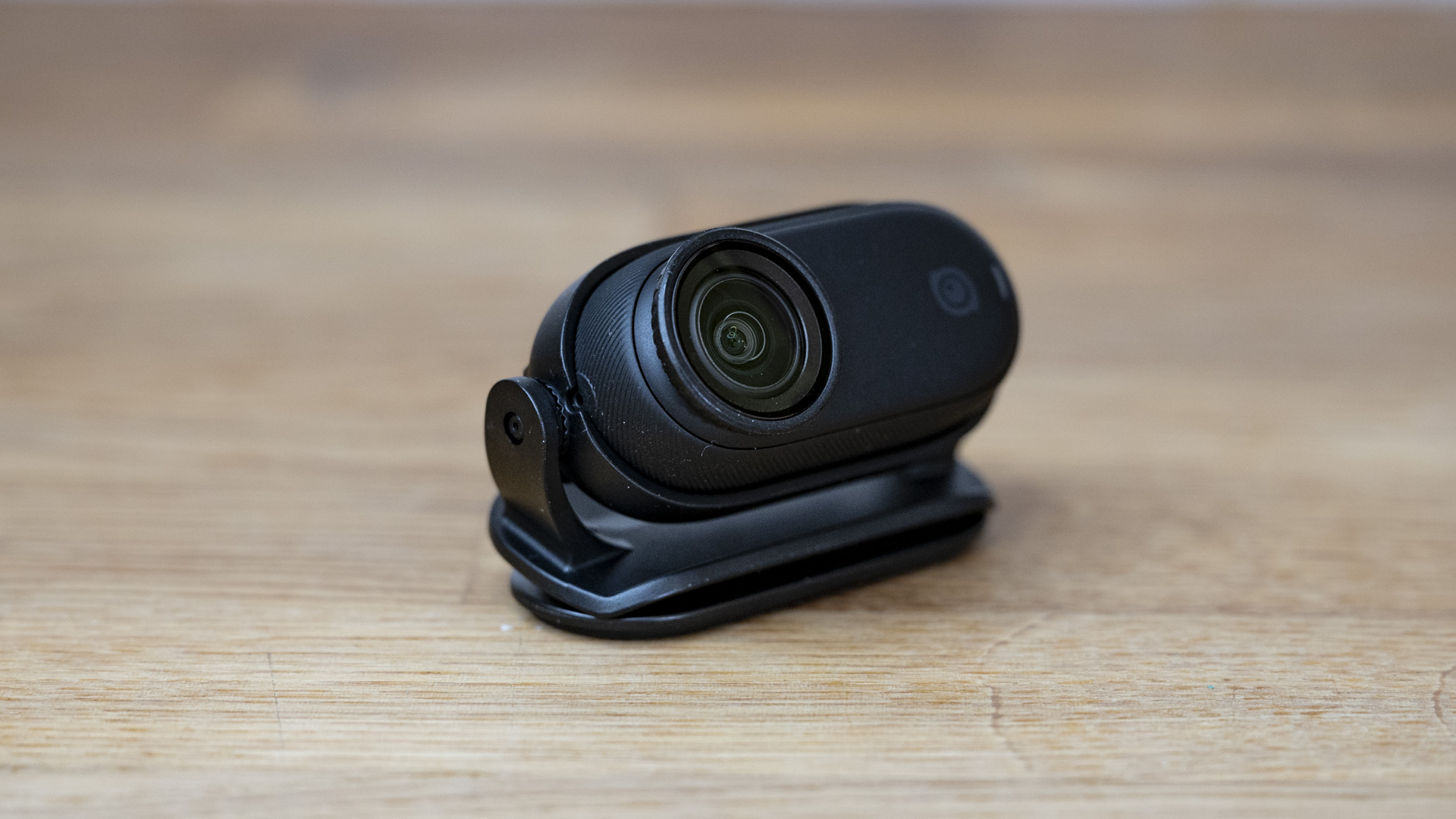 Insta360 Go 3S camera secured in a clip accessory