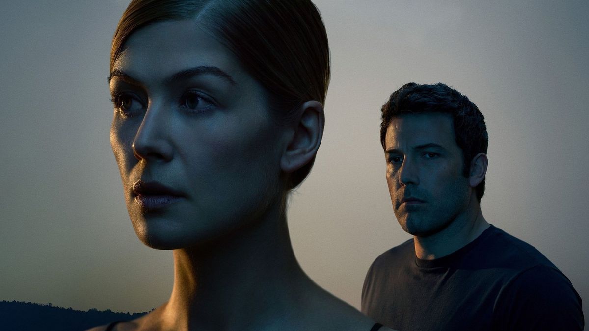 A screenshot of Rosamund Pike's Amy being watched by Ben Affleck's Nick in Gone Girl