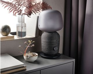 Smart lamp with speaker on table