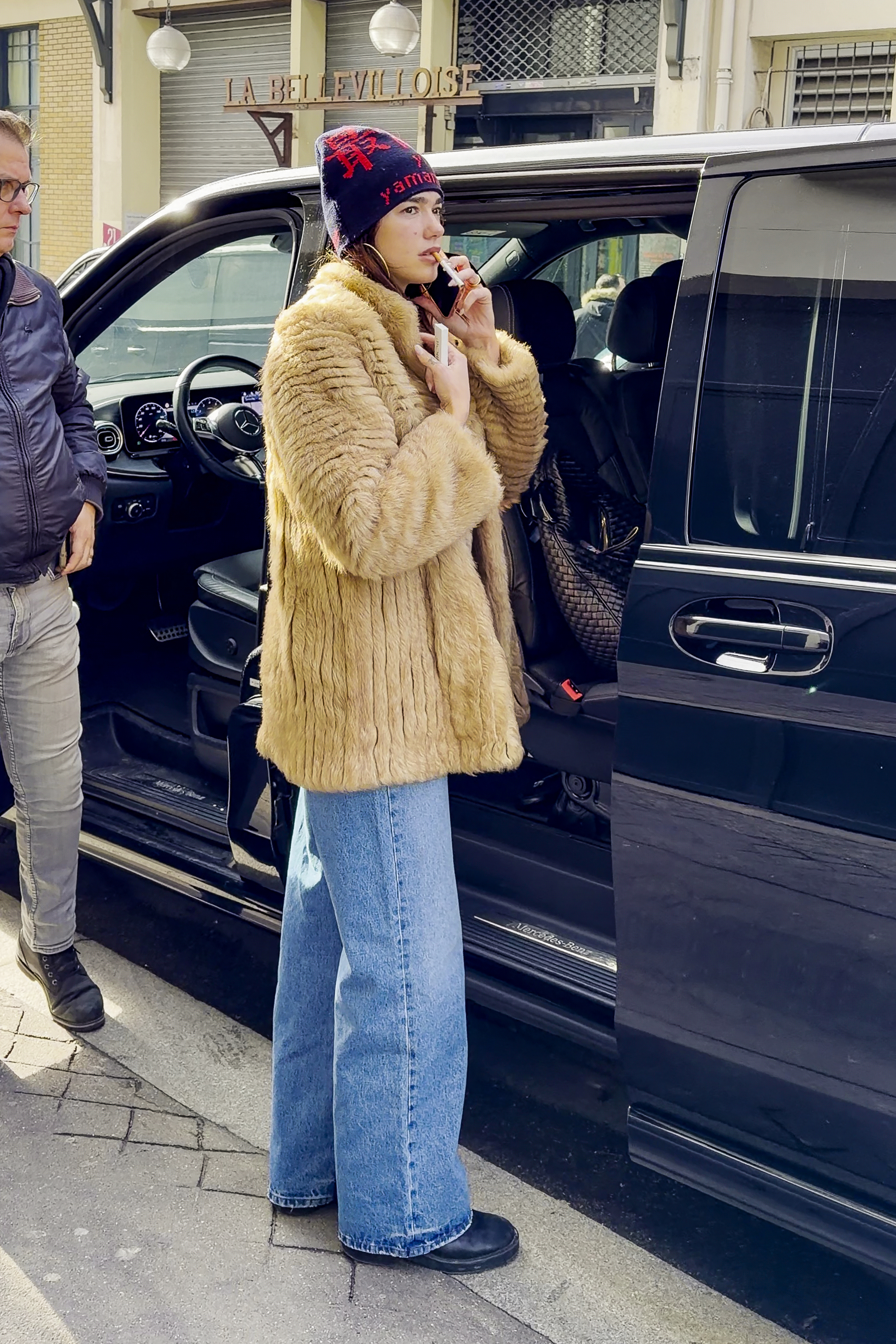 Dua Lipa paired the rising straight-leg jeans trend with a $19,000 fur coat from Valentino