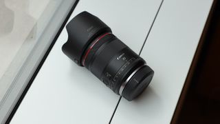 Canon RF 35mm f/1.4L VCM lens on a white surface in front of a window