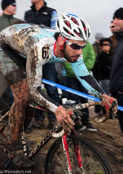 A rider descends a short drop-off.