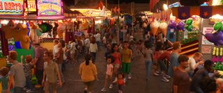 CGI scene of people enjoying a carnival at night