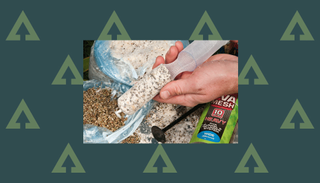 How to catch carp on bread - bread crumbs being compressed into a cobweb mesh tube