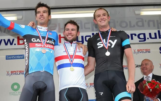 Cavendish stands with the champions jersey between former winners David Millar and Ian Stannard