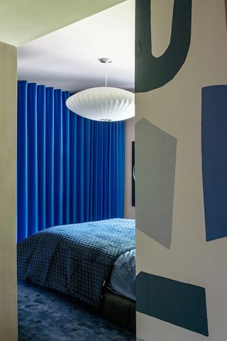 modern bedroom with blue curtains
