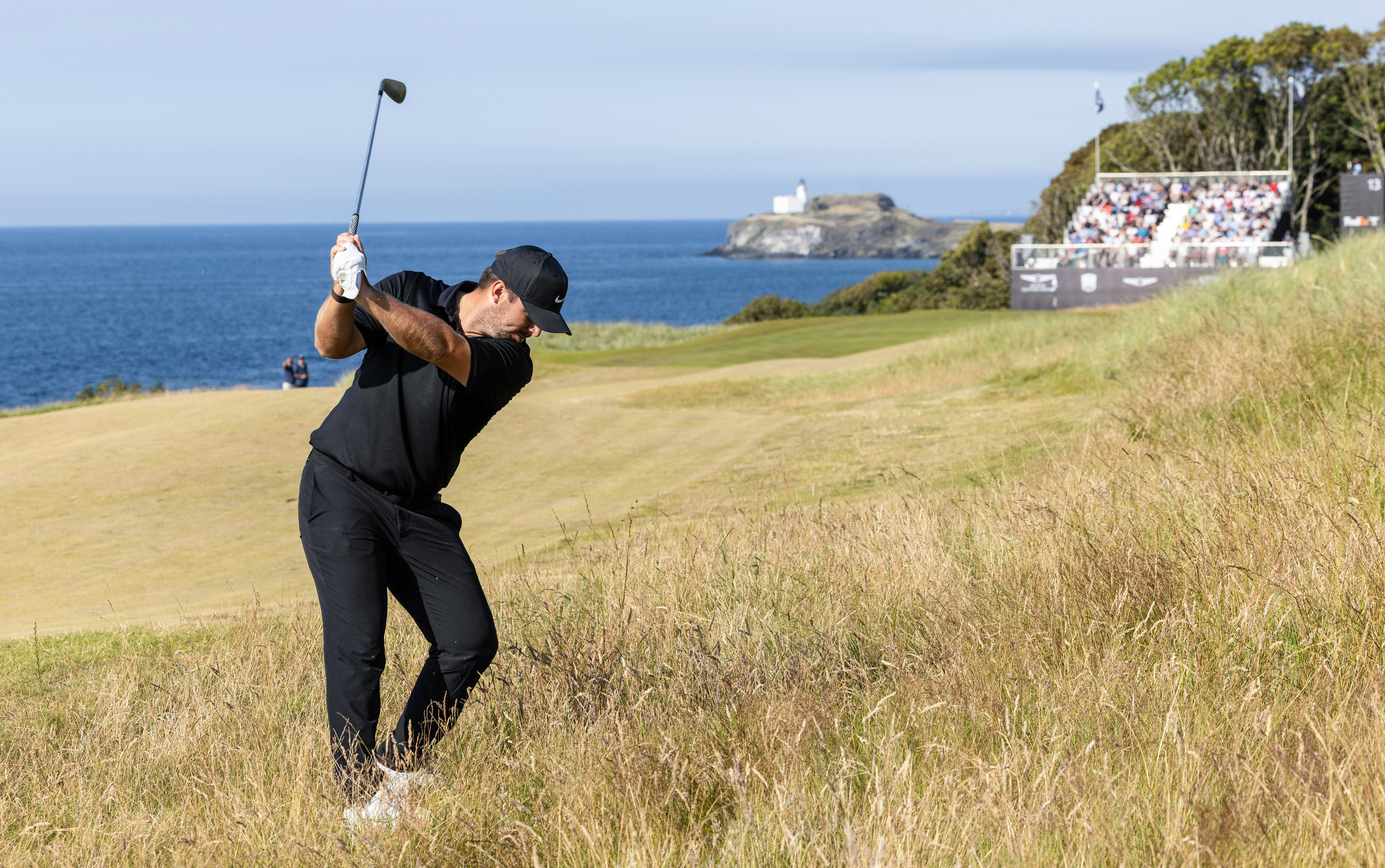 Chris Gotterup hits a shot from the rough