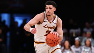 Jalen Quinn of the Loyola Ramblers dribbles the basketball