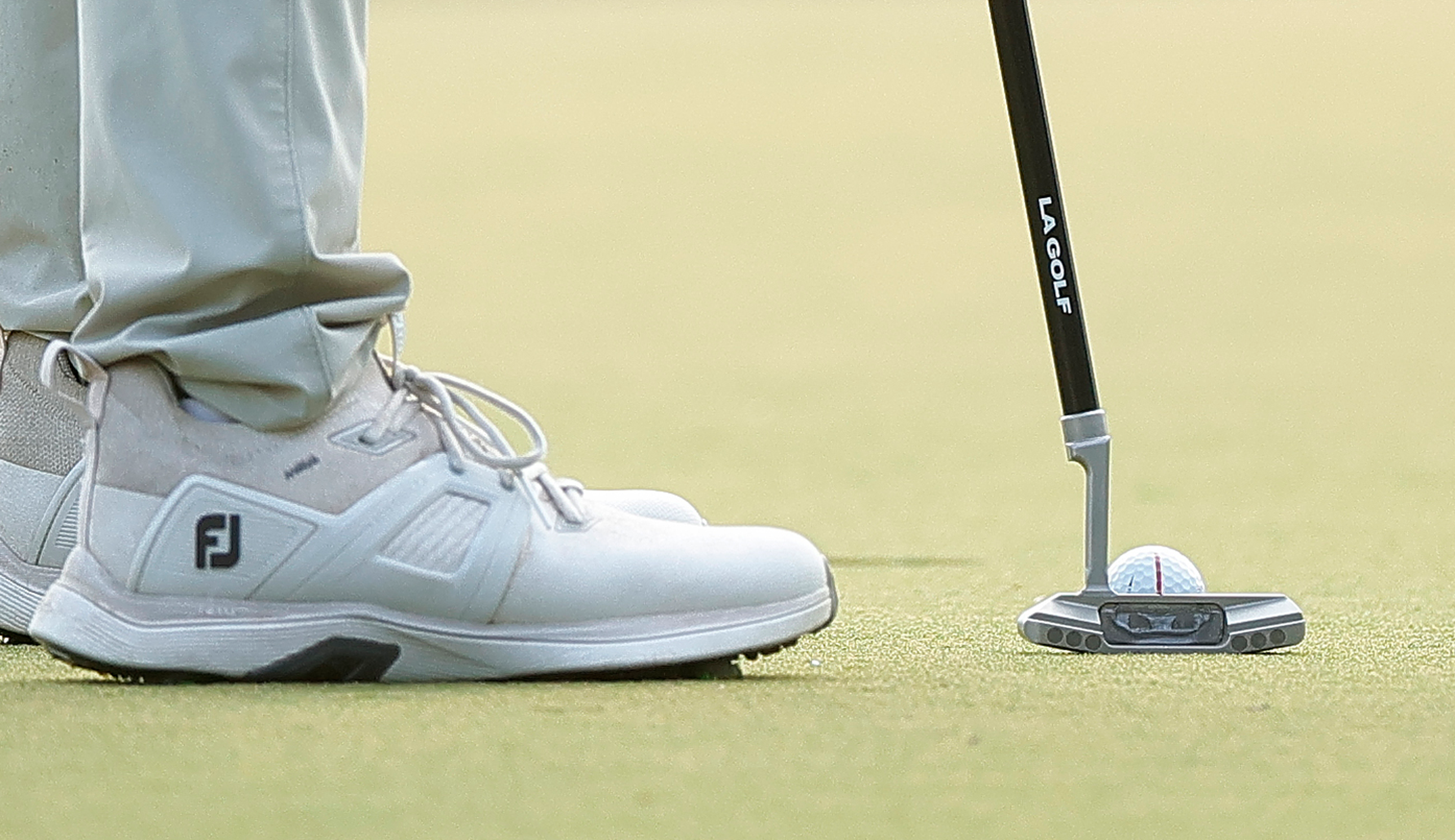 A close-up of Bryson DeChambeau's putter