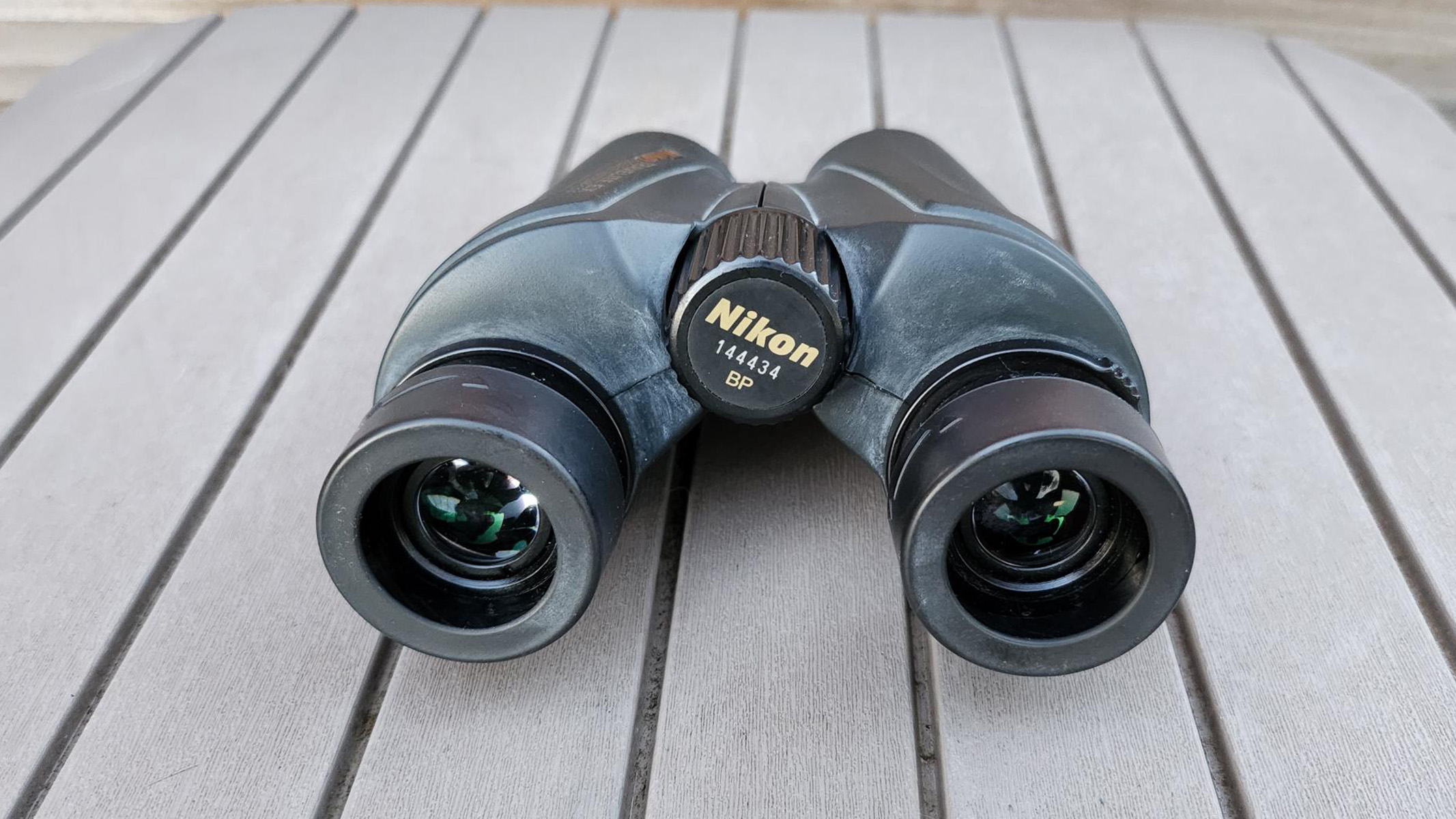 A photo showing the small 25mm aperture of the Nikon Travelite EX 8x25 binoculars
