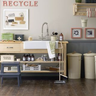 kitchen area with washbasin and wooden counter