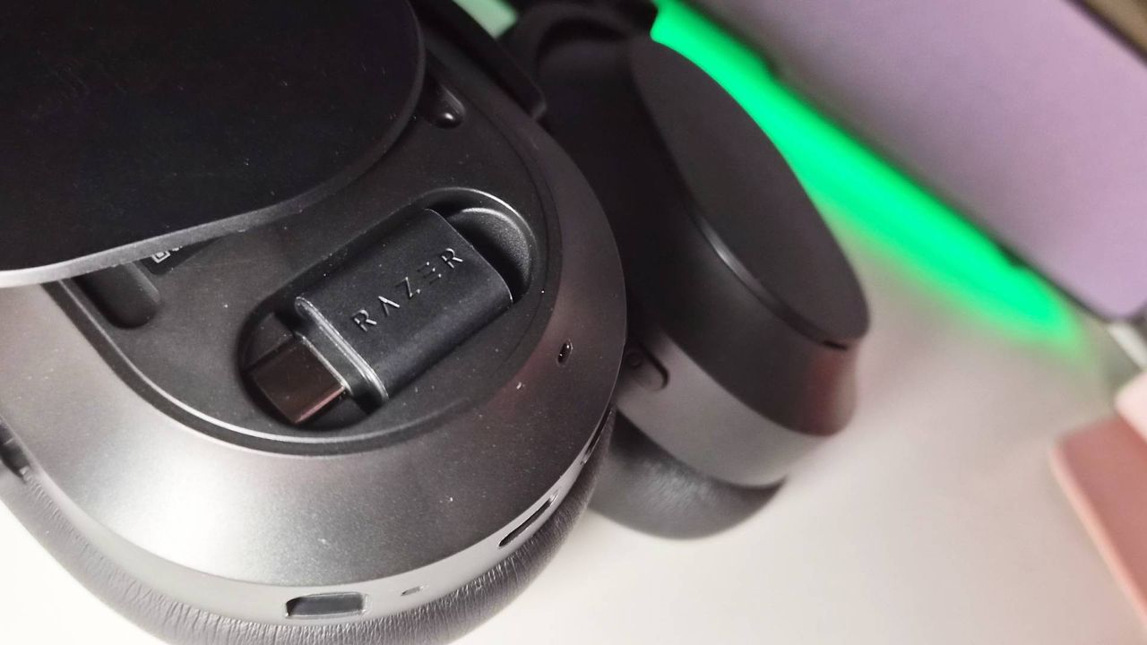 Photo of the Razer Barracuda V2 Pro headset sitting on a white desk.