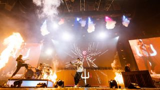 Twenty One Pilots rocks out with flames using an L-Acoustics sound system for high-quality audio.