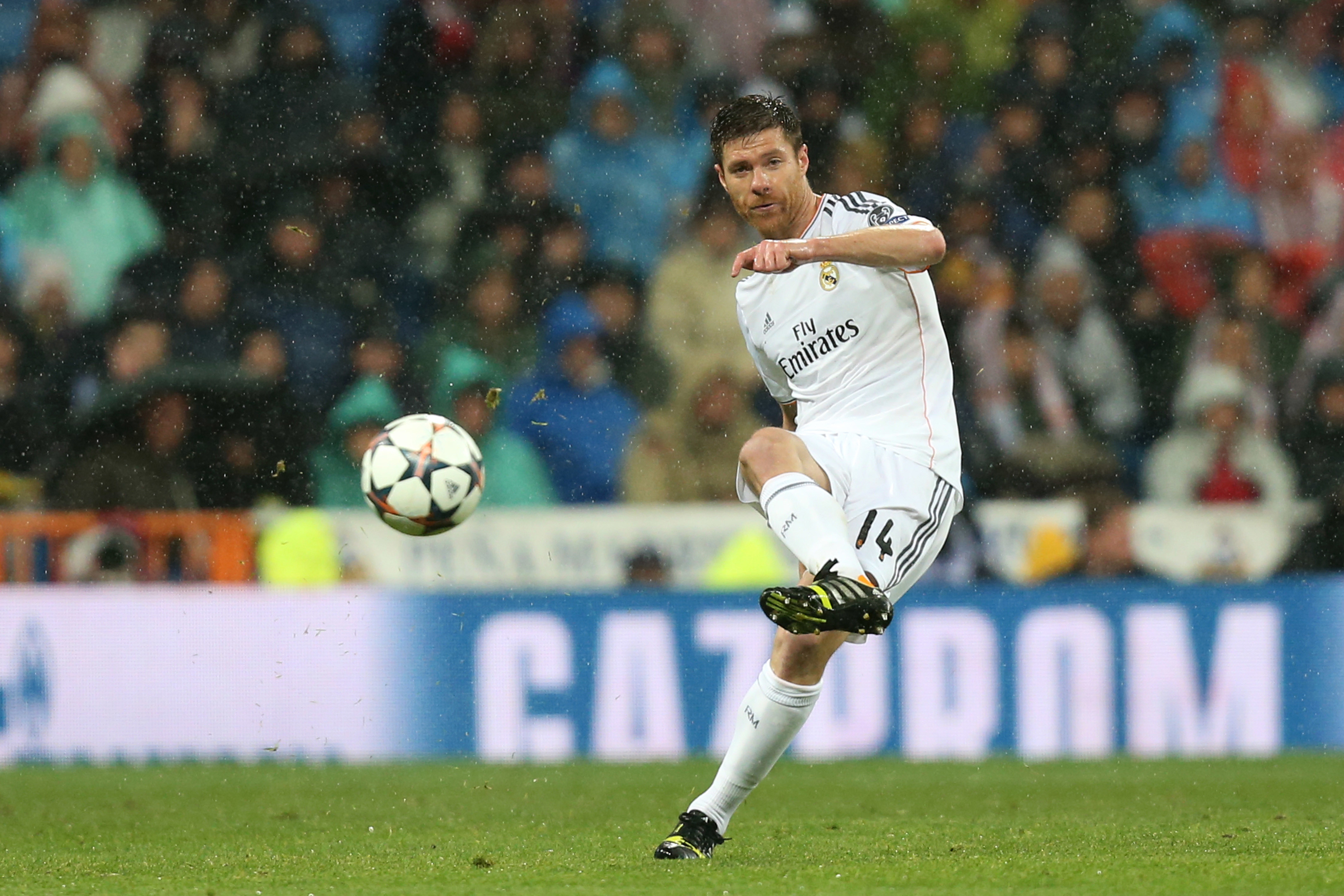 Xabi Alonso plays a pass during Real Madrid's Champions League quarter-final against Borussia Dortmund in 2014.