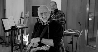 A black-and-white photo of David Gilmour tracking new solo album Luck and Strange in the studio.