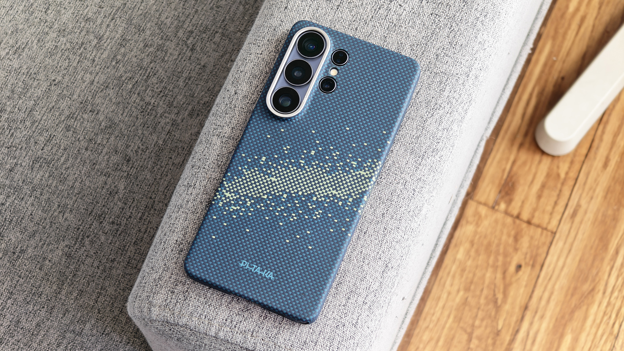 A Samsung Galaxy S26 Ultra wearing a blue Pitaka Edge case