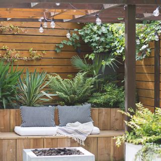 pergola area with outdoor seating and fire pit