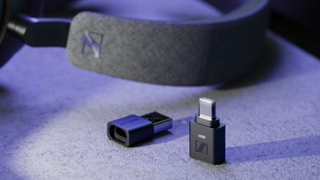 Sennheiser BTD 700 on table next to headphones